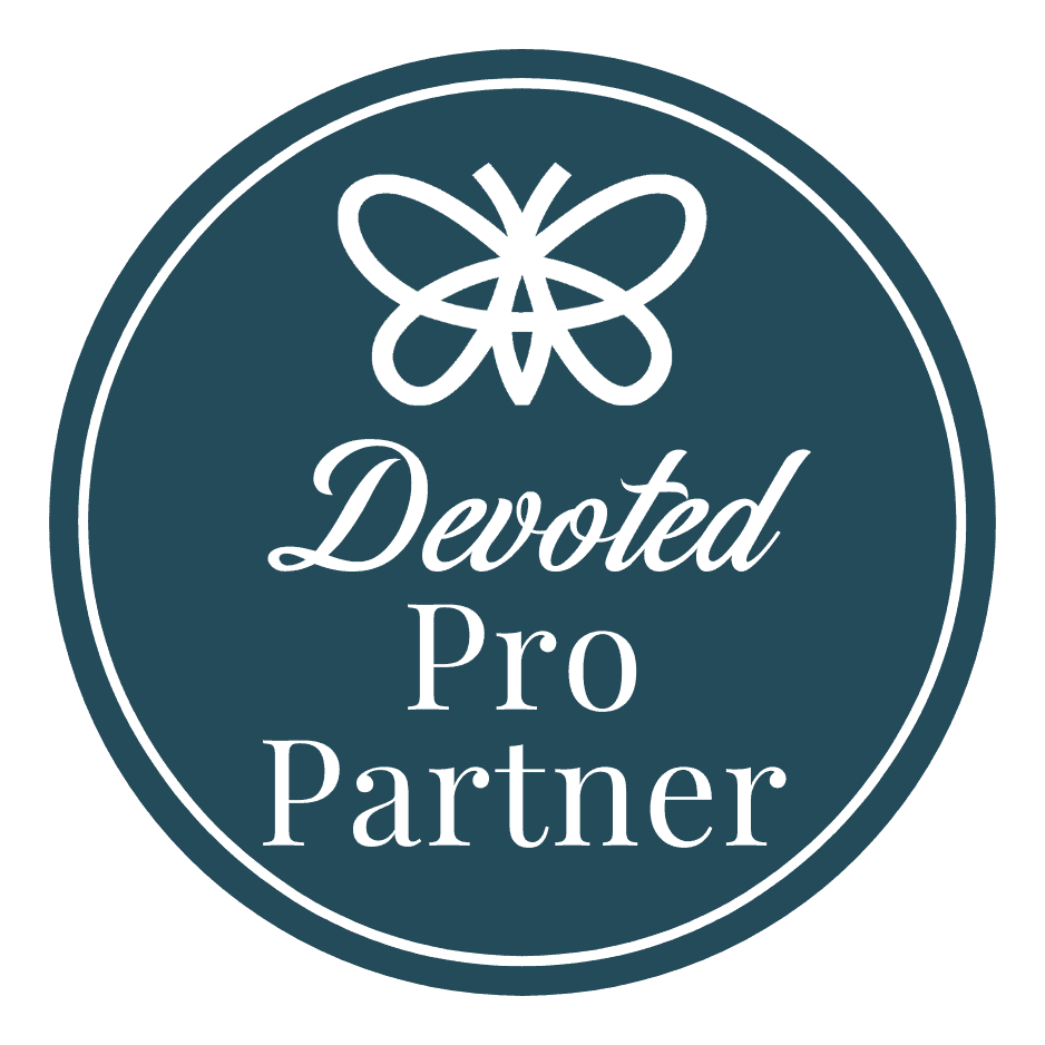 Pro-Partner Circular badge with a butterfly icon at the top and the words "Devoted Pro Partner" in white text on a dark teal background.