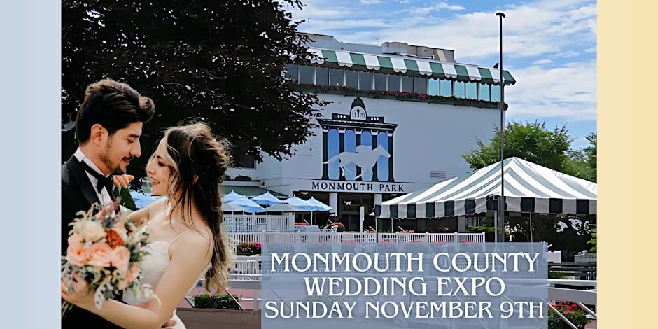 A bride and groom in a romantic pose in front of the Monmouth Park building with a large striped tent nearby.