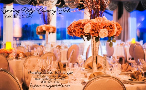 Elegant wedding reception setup with blush and peach floral centerpieces, crystal glassware, and golden accents at Basking Ridge Country Club.