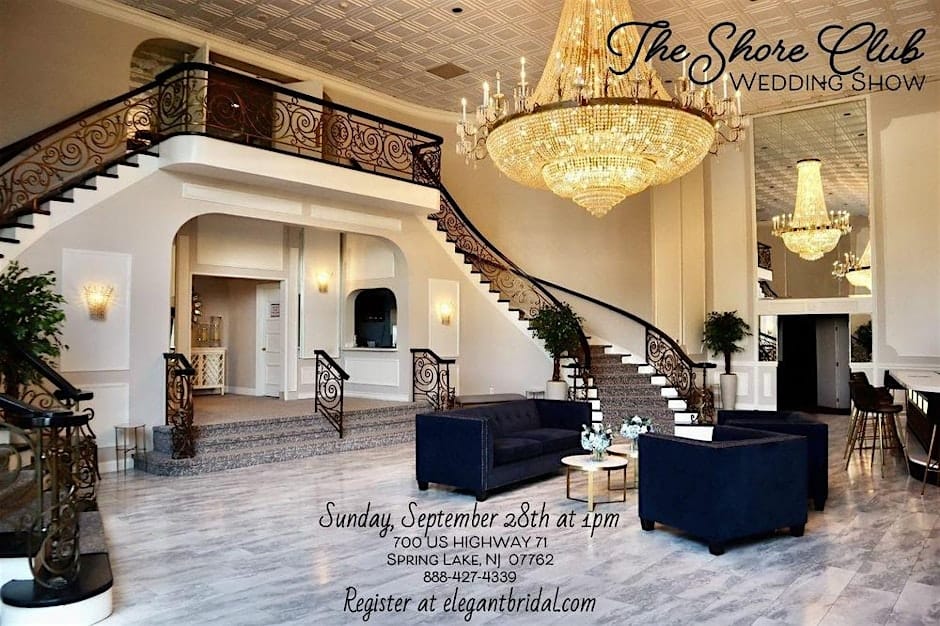 An interior photo of The Shore Club's grand lobby, featuring a large spiral staircase, elegant lounge furniture, and a massive crystal chandelier.