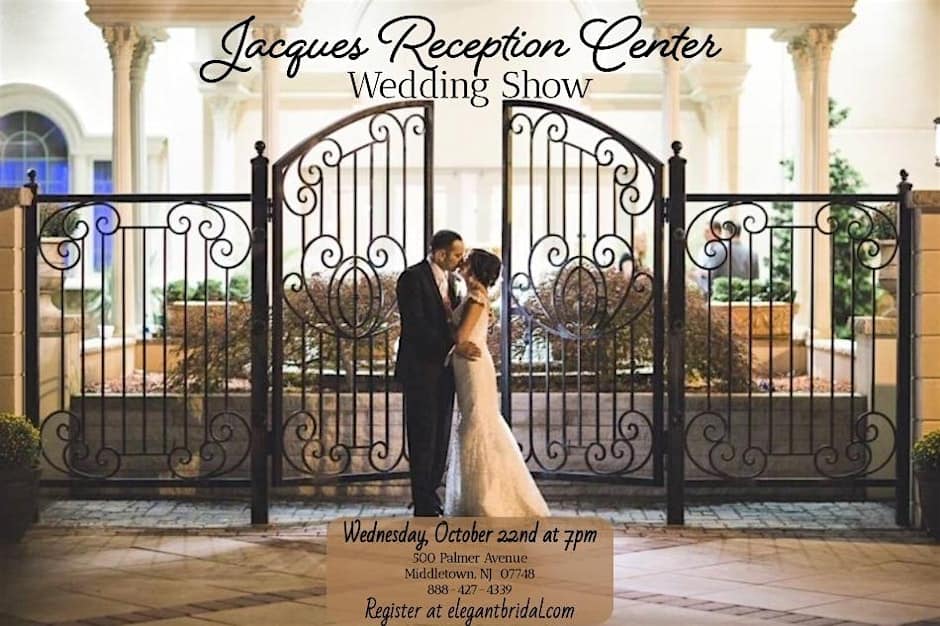 A bride and groom share a kiss in front of the elegant iron gates at Jacques Reception Center in Middletown NJ.