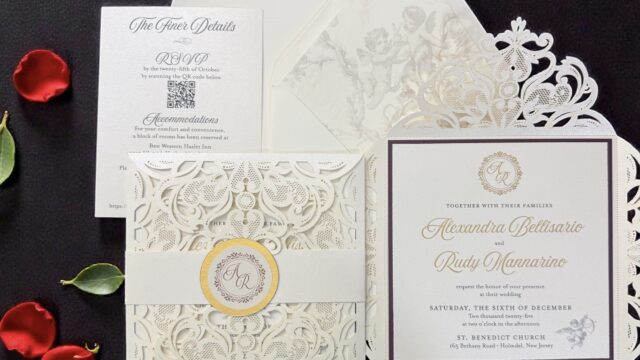 Luxury laser-cut wedding invitation suite with monogram details, RSVP card, envelopes, and decorative floral elements created by Tina Conway Designs.